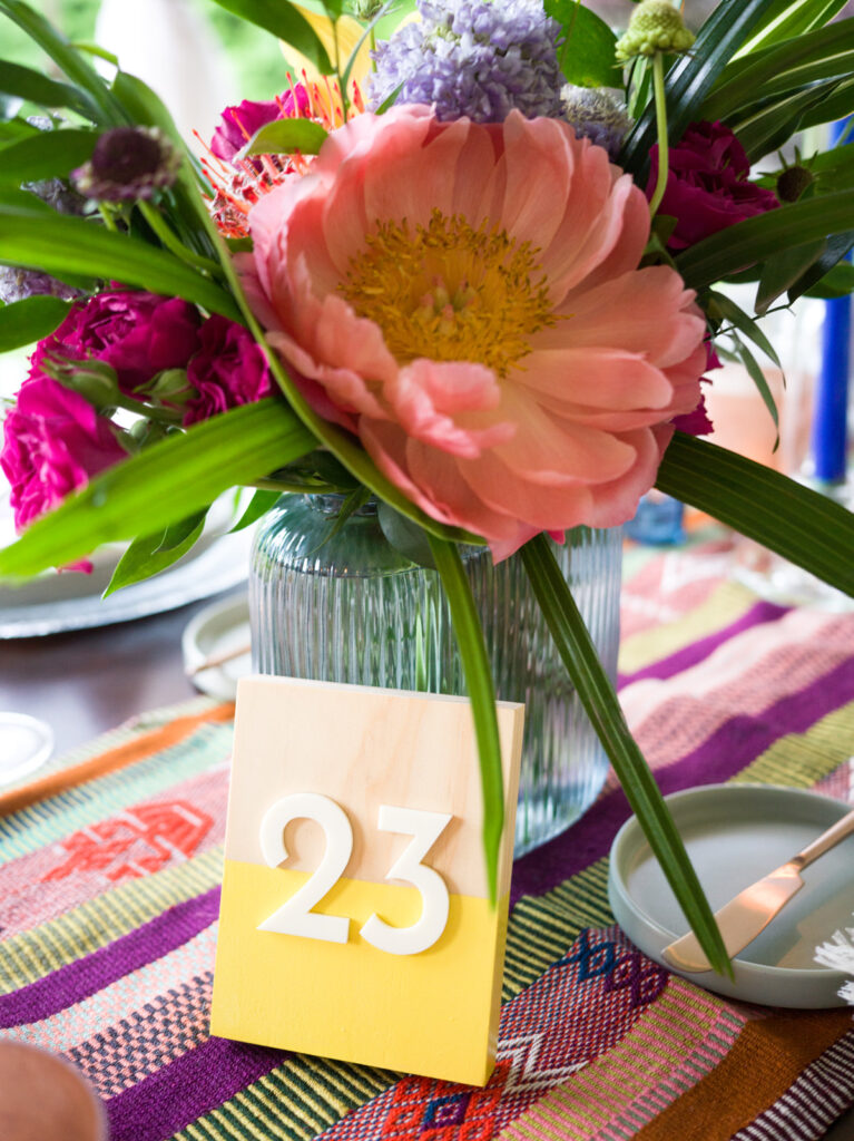 Color-block wooden table numbers with acrylic numbers created by Mittens and Lakes for Anne Marie and Eric’s wedding.”